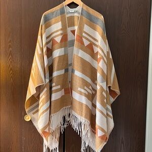 Nostalgia cream and tan Aztec print poncho. One size.